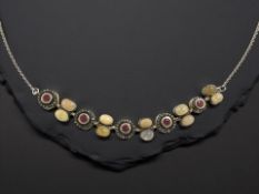An early 20th century necklace with diamond ruby and opal line-set pendant, length 53.5 cm.