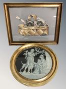 A needlework picture depicting puppies in a basket,