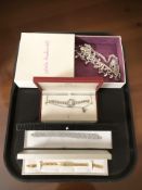 A small quantity of boxed costume jewellery, ladies wristwatch signed 'Rojas', two bracelets, etc.