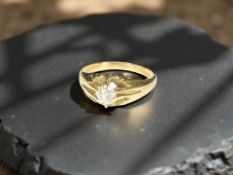 A high carat yellow gold diamond solitaire ring, size L.