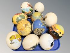 A collection of painted / transfer printed ostrich eggs.