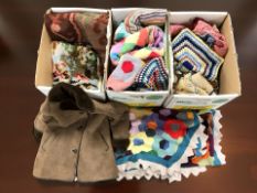 A collection of colourful woolen blankets and throws, suede coat, etc.