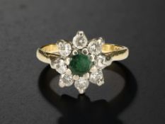 An 18ct gold emerald and diamond cluster ring, size K CONDITION REPORT: 3.