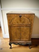 A 20th century Gold Feather Products burr walnut drinks cabinet, 75 cm x 40 cm x 127 cm.