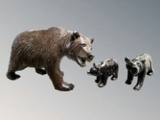 A 20th century black forest bear and two cubs, largest 13 cm long.