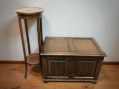 An oak blanket box and an Edwardian inlaid mahogany plant stand.