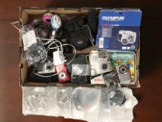 A group of modern digital cameras including Canon, Nikon, other electricals, headphones, etc.