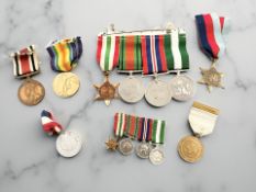 A WWII group of four medals and accompanying miniatures, WWI Victory Medal named to 10602 Pte. G.