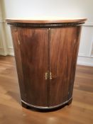 A 19th century mahogany bow front corner cabinet, height 101 cm.