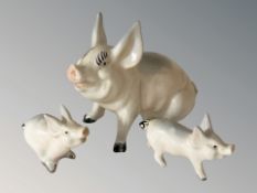 A group of three Beswick pigs, tallest 9 cm.