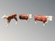 Two Beswick cows CH. of Champions, and a further Beswick calf, tallest 11 cm.