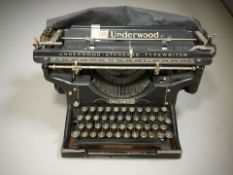 An Underwood Standard typewriter, with protective cover.