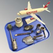 A model aircraft, an onyx table lighter, a Cshuco wind-up frog toy, with winder, a shoe stretcher,