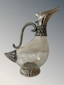 A glass and silver plate decanter in the form of a bird, height 28 cm.