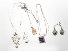 A group of silver pendants, brooch,