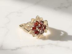 A 9ct gold garnet cluster ring, size M CONDITION REPORT: 2.