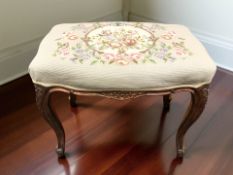 A continental carved beech tapestry stool, width 63 cm.