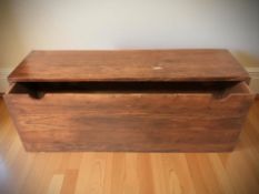 A large stained wooden single drawer storage chest, 140 cm x 40 cm x 60 cm.