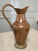 A large copper harvest jug, height 65 cm.