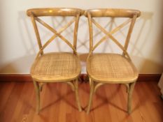 A pair of elm and wicker occasional chairs.