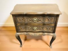 A continental carved oak two drawer chest, 66 cm x 38 cm x 66 cm.