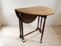 A mahogany drop leaf Sutherland table.