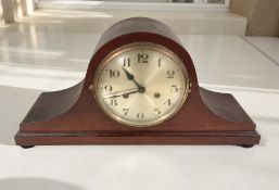 An early 20th century mantel clock with silvered dial, width 49 cm.