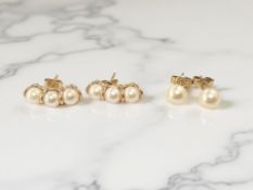 A pair of 9ct gold cultured triple-pearl earrings, plus a further similar pair.
