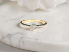 An 18ct gold diamond solitaire ring,