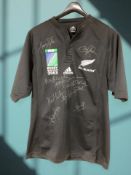 An Adidas Rugby World Cup 2003 New Zealand All Blacks rugby shirt, with various signatures, size L.
