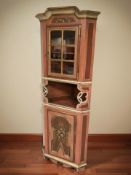 A continental painted and gilt corner cabinet, height 192 cm.