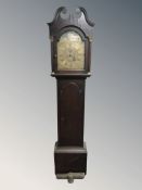 An early 19th century oak long case clock with brass moon phase dial signed James Robinson,