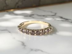 A 9ct gold amethyst half eternity ring, size P CONDITION REPORT: 1.