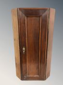A 19th century mahogany corner cabinet, height 74 cm.