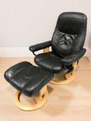 A Norwegian Stressless black leather swivel lounge armchair and matching footstool.