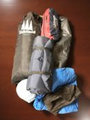 A group of camping equipment, mattresses, tent, etc, in carry bags.