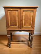 A continental walnut double door cabinet, 85 cm x 43 cm x 130 cm.