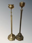 Two brass smoker's stands.