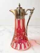 An etched cranberry glass and silver-plate decanter, height 27cm.