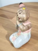 A Thai carved and painted figure of a kneeling lady, height 53 cm.