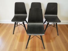 A set of four Scandinavian stained and laminated dining chairs.