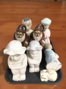 A group of oriental carved and painted wooden figures.