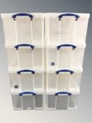 A set of eight plastic stackable 64L storage boxes with lids, each 67 cm x 44 cm x 30 cm.