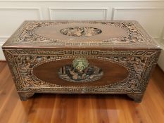 An oriental carved camphorwood blanket chest, 93 cm x 45 cm x 50 cm.