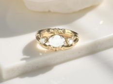 A 9ct gold opal and diamond three stone ring, size M CONDITION REPORT: 2.