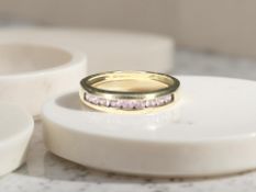 A 9ct gold pink sapphire half-eternity ring,