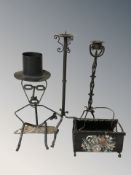 A group of wrought metal items including candlesticks, magazine rack,