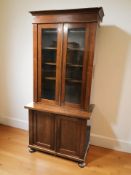 A continental glazed mahogany bookcase, 92 cm x 50 cm x 199 cm.