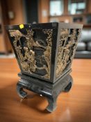 An oriental black lacquered and gilt planter, height 44 cm.