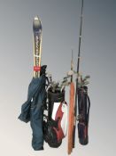 Three golf bags containing assorted irons and drivers including Ben Sayers, Calloway, etc.